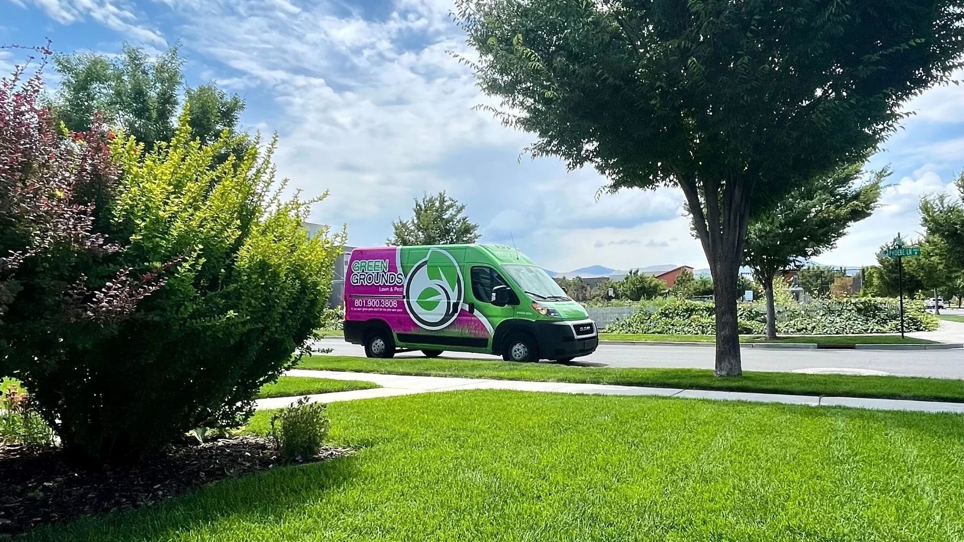 Green Grounds Lawn & Pest van at customer's home in Midway, UT.