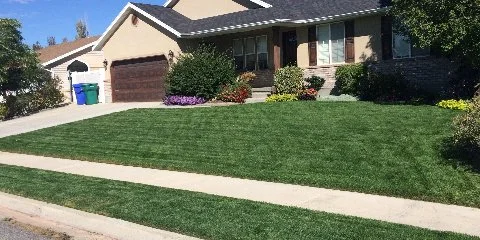 House in Herber, UT with a perfect front lawn.